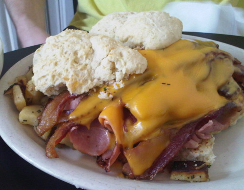 Ultimate Biscuits Three biscuits topped with ham, pork sausage, bacon, cheese, two over easy eggs, and gravy. (Submitted by Amy Kauffman via breadwinnerscafe)