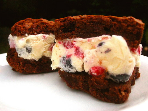 The Pursuit Of Awesomeness Ice Cream Sandwich Vanilla ice cream with raspberries and blueberries between two chocolate brownies. (via yumsugar)